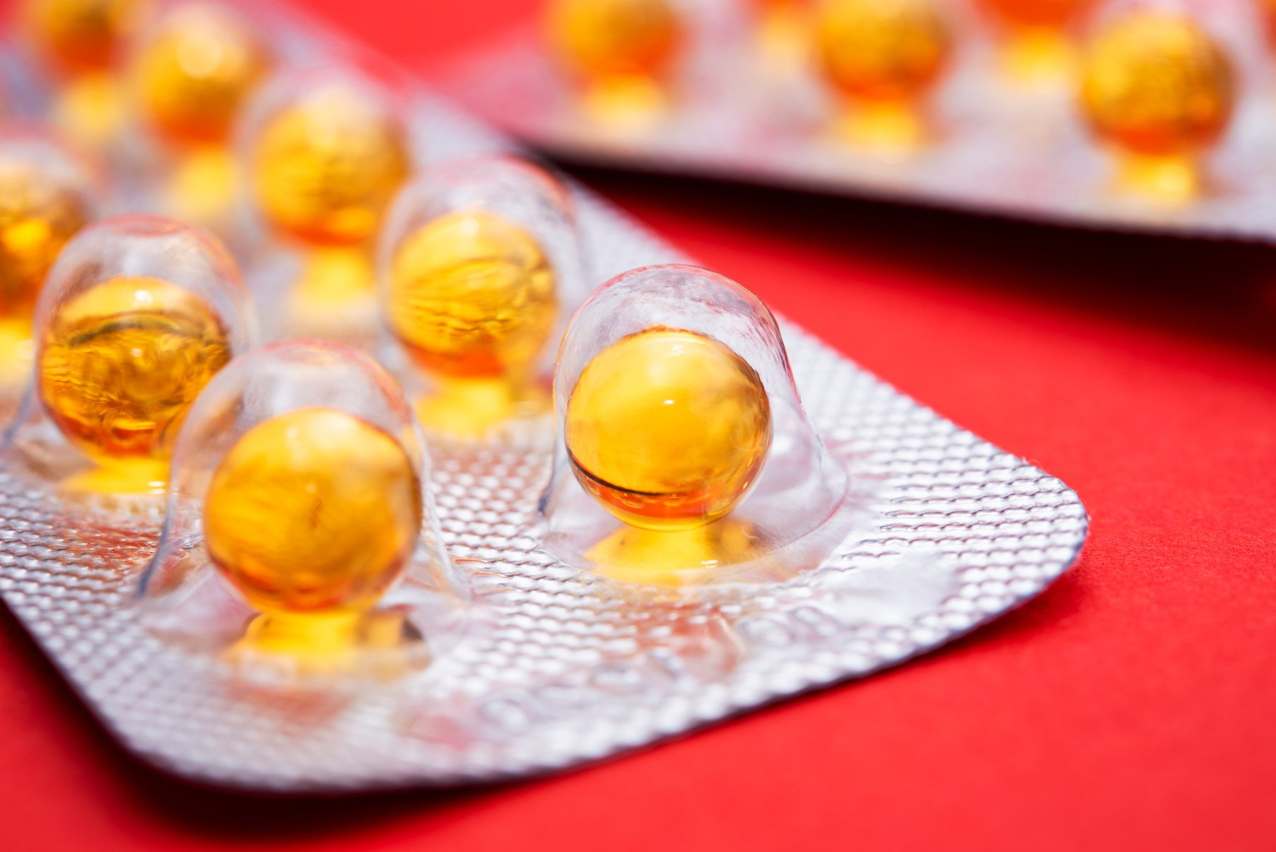 Yellow round pills in blister pack closeup